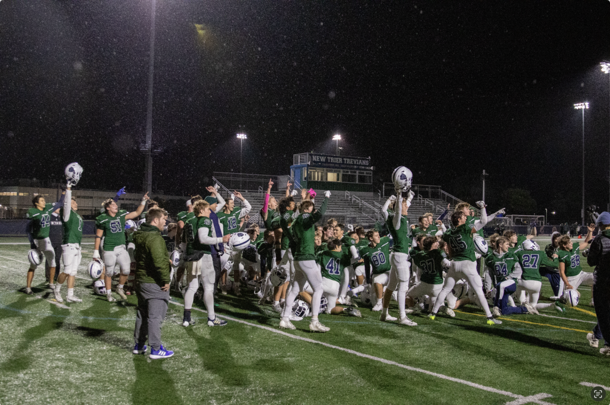 New Trier football players and coaches at the Oct. 26 game against Glenbrook North High School